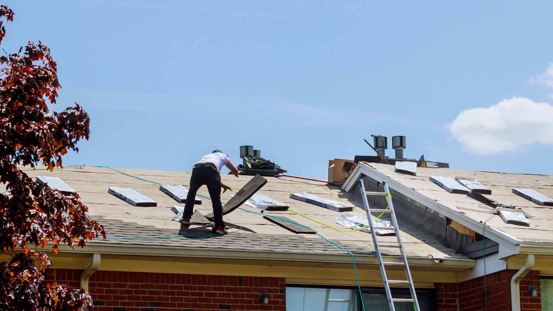 Roofing professional carefully working on a Burlington County home